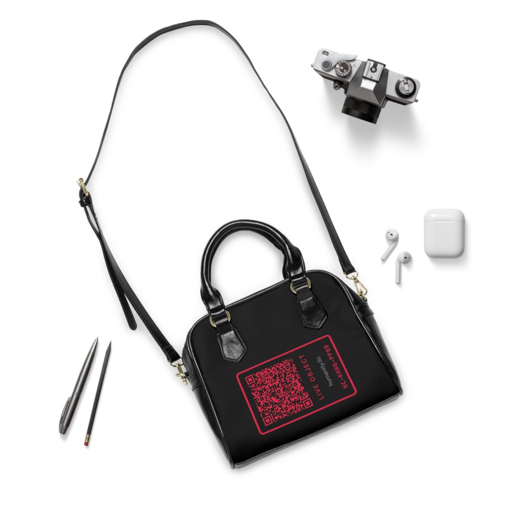 Founding purse flat lay with camera and earbuds