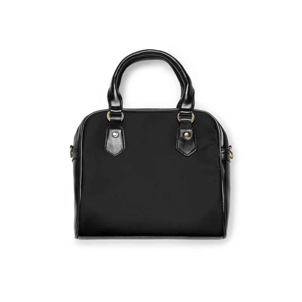 Founding purse back view on black satchel