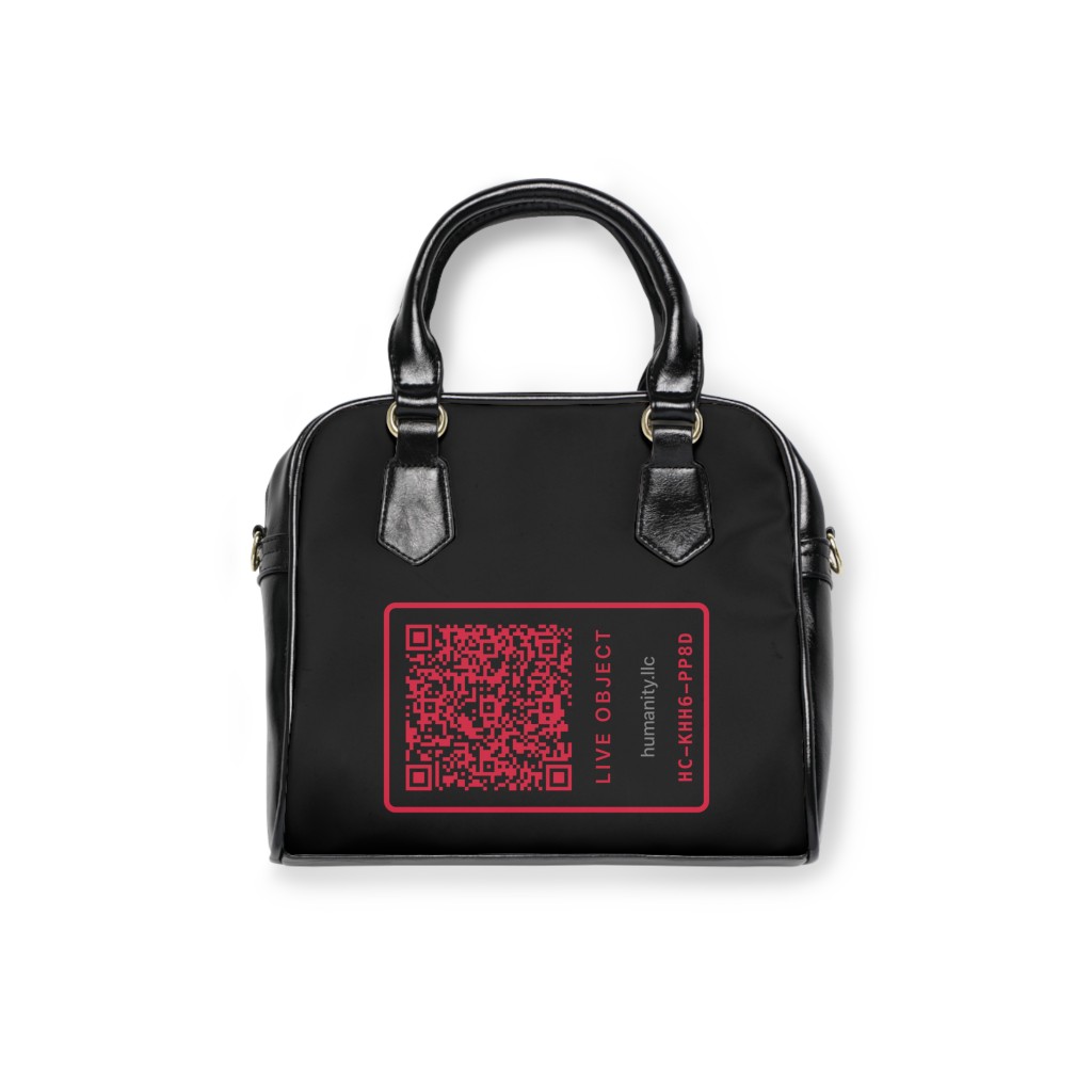 Founding purse front view with LIVE OBJECT graphic on black satchel
